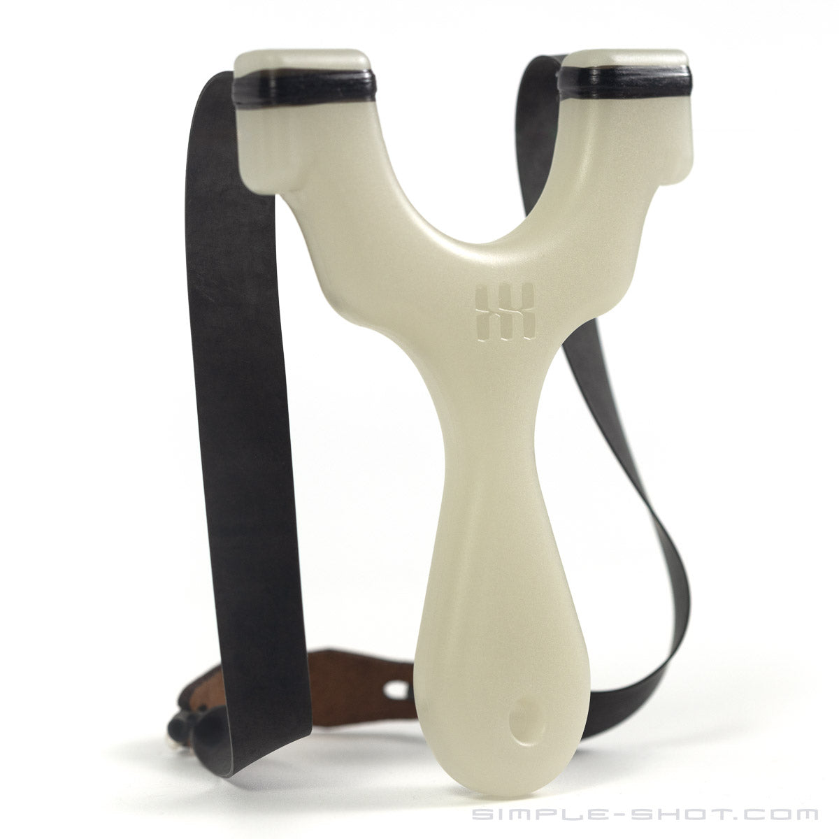 A glow in the dark Y-shaped Axiom Champ Slingshot with black rubber bands is displayed against a white background. The thin handle complements the compact design, and the bands are securely attached to the prongs.